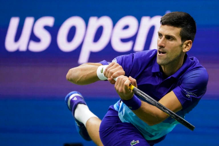 File photo: Novak Djokovic, of Serbia, returns a shot to Alexander Zverev, of Germany, during the semifinals of the U.S. Open tennis championships, Friday, Sept. 10, 2021, in New York. Djokovic will not play in the U.S. Open, as expected, because he is not vaccinated against COVID-19 and thus is not allowed to travel to the United States. Djokovic announced his withdrawal from the year’s last Grand Slam tournament on Twitter on Thursday, Aug. 25, 2022, hours before the draw for the event was revealed.  (AP Photo/John Minchillo, File)