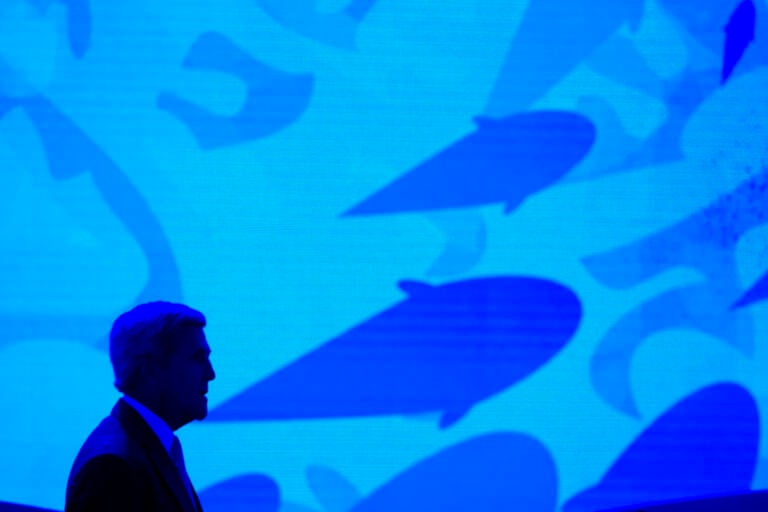 File photo: Secretary of State John Kerry stands onstage against a video backdrop of ocean life during the Our Ocean, One Future conference at the State Department in Washington, Thursday, Sept. 15, 2016. (AP Photo/Cliff Owen, File)