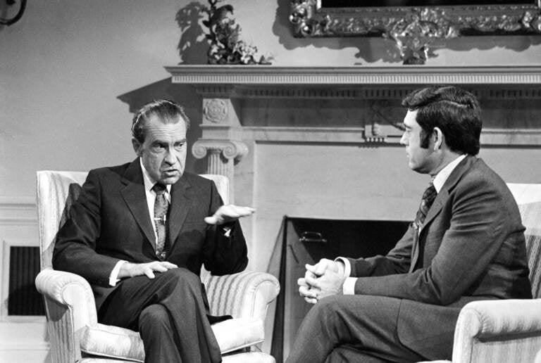 President Richard Nixon talks with correspondent Dan Rather before an interview at the White House in Washington, Jan. 2, 1972. (AP Photo/Harvey Georges)