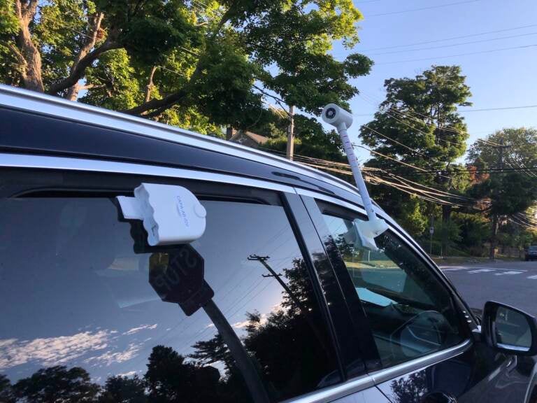 Temperature and air quality sensors attached to Carolyn Martin's car. (Sophia Schmidt/WHYY)