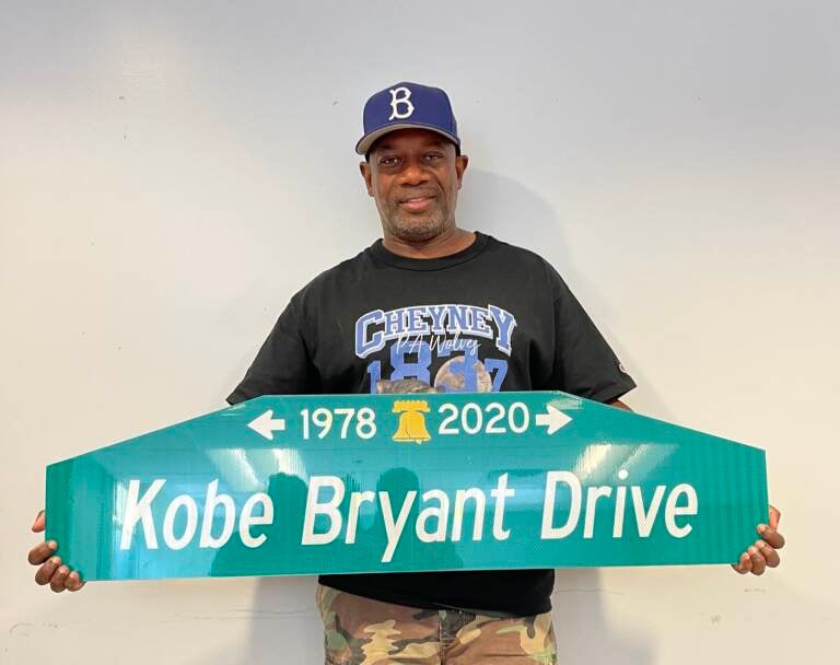 LeRoy McCarthy holds up a street sign for the proposed Kobe Bryant Drive. (Courtesy of LeRoy McCarthy)