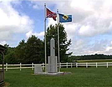 The Confederate flag and monument at the Marvel Carriage Museum. (WHYY file)