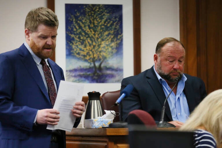 Mark Bankston, lawyer for Neil Heslin and Scarlett Lewis, asks Alex Jones questions about text messages during trial at the Travis County Courthouse