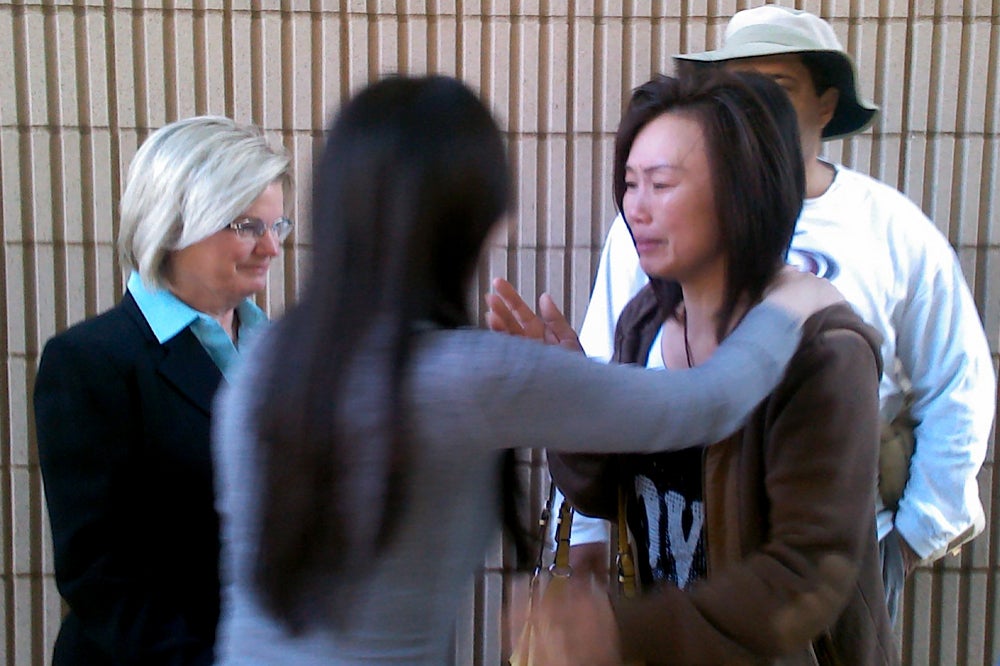 Bei Bei Shuai, second from left, hugs her friend, after Shuai's release on bail from the Marion County Jail in Indianapolis