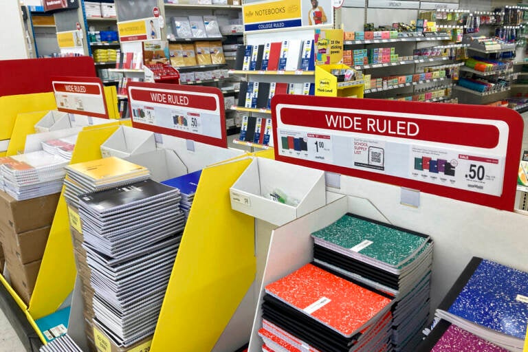Stacks of notebooks are shown in a store.