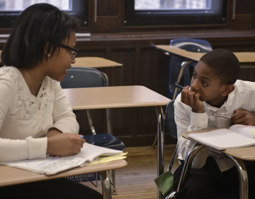 A student and teacher at Philadelphia’s Academy at Palumbo, a school that uses selective admissions. In 2021, the city district changed the system for admissions to the top-tier schools to a lottery process. (Charles Mostroller / The Notebook)