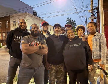 Volunteers with Corners to Connections gather after a night of street outreach. The faith-based coalition patrolled every night in June and is continuing  throughout August. From left to right (back row): G Lamar Stewart, Morgan Wilson, Joe Massengale, Mark Christian, Sonya Umble, Tirzah Cannad From left to right (front row): Jeffrey Browne, Julius Renwick Aliya Bradley (Beatrice Forman/WHYY)
