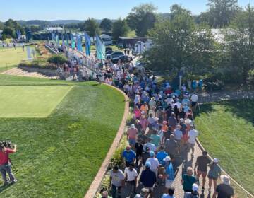 A parade of fans stream into Wilmington Country Club for the opening round.