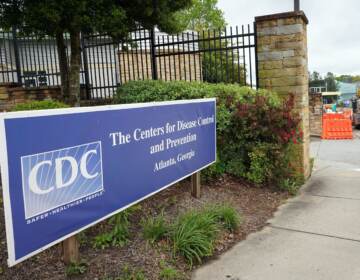 A sign is seen by the entrance of the Centers for Disease Control and Prevention in Atlanta on April 23, 2020. The CDC said it is investigating an E. coli outbreak in four states that has sickened at least 37 people. (Tami Chappell/AFP via Getty Images)