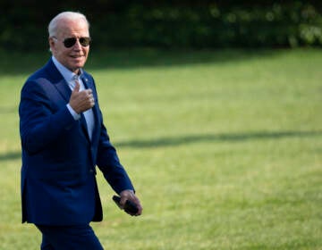 File photo: President Joe Biden gestures toward reporters as he departs Marine One and walks to the Oval Office on the South Lawn of the White House on July 20. (Drew Angerer/Getty Images)