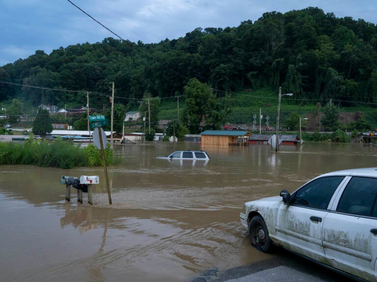 Vehicles are seen in floodwaters downtown in Jackson, Kentucky