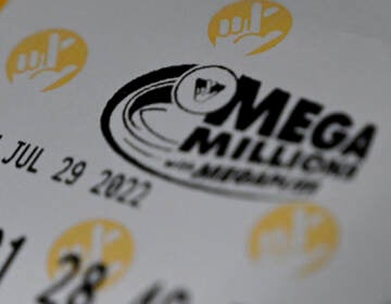A Mega Millions lottery ticket at a store on July 29 in Arlington, Va. The winner of the $1.34 billion jackpot has not come forward to claim their prize yet. (Olivier Douliery/AFP via Getty Images)