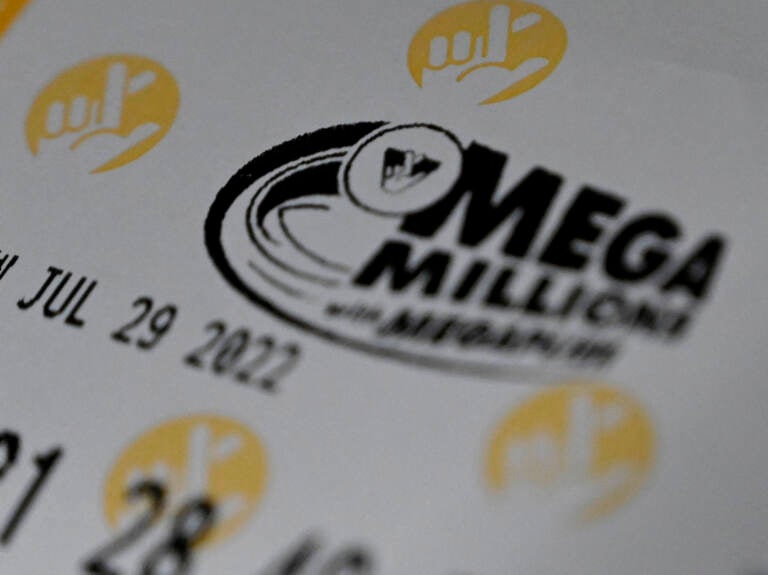 A Mega Millions lottery ticket at a store on July 29 in Arlington, Va. The winner of the $1.34 billion jackpot has not come forward to claim their prize yet. (Olivier Douliery/AFP via Getty Images)