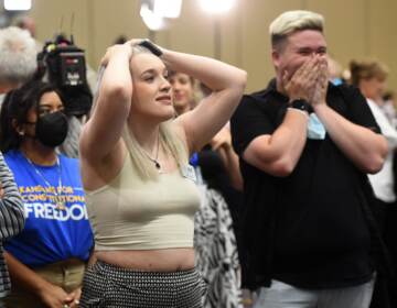 Alie Utley and Joe Moyer react to their county voting against the proposed constitutional amendment during the Kansas for Constitutional Freedom primary election watch party in Overland Park, Kansas on August 2. (DAVE KAUP/AFP via Getty Images)