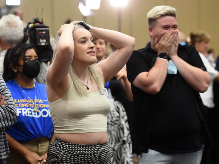 Alie Utley and Joe Moyer react to their county voting against the proposed constitutional amendment during the Kansas for Constitutional Freedom primary election watch party in Overland Park, Kansas on August 2. (DAVE KAUP/AFP via Getty Images)