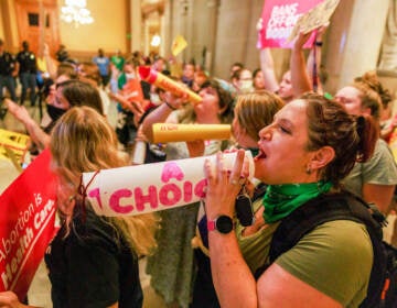 Abortion rights activists chant slogans as the Indiana Senate debates during a special session in Indianapolis before voting to ban abortions. (SOPA Images/LightRocket via Getty Images)