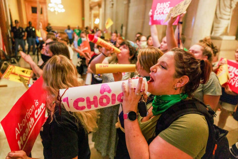 Abortion rights activists chant slogans as the Indiana Senate debates during a special session in Indianapolis before voting to ban abortions. (SOPA Images/LightRocket via Getty Images)