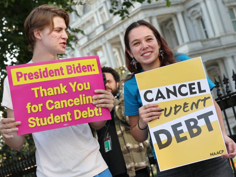 Student loan borrowers stage a rally in front of The White House on Aug. 25 to celebrate President Biden cancelling student debt. The plan has sparked heated debate, including about its economic fairness. (Paul Morigi/Getty Images for We the 45m)