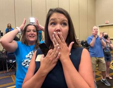 Kansas state Rep. Stephanie Clayton reacts as a referendum to strip abortion rights out of the state constitution fails.