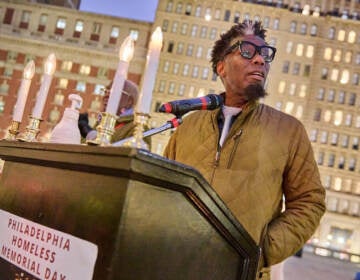 Michael Hinson speaks at a vigil