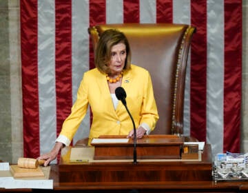 House Speaker Nancy Pelosi of Calif., finishes the vote to approve the Inflation Reduction Act in the House chamber at the Capitol in Washington, Friday, Aug. 12, 2022. A divided Congress gave final approval Friday to Democrats' flagship climate and health care bill. (AP Photo/Patrick Semansky)