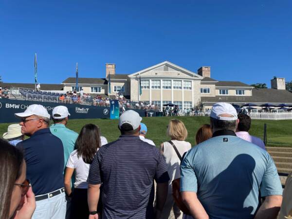 Fans look toward the first tee. (Cris Barrish/WHYY)
