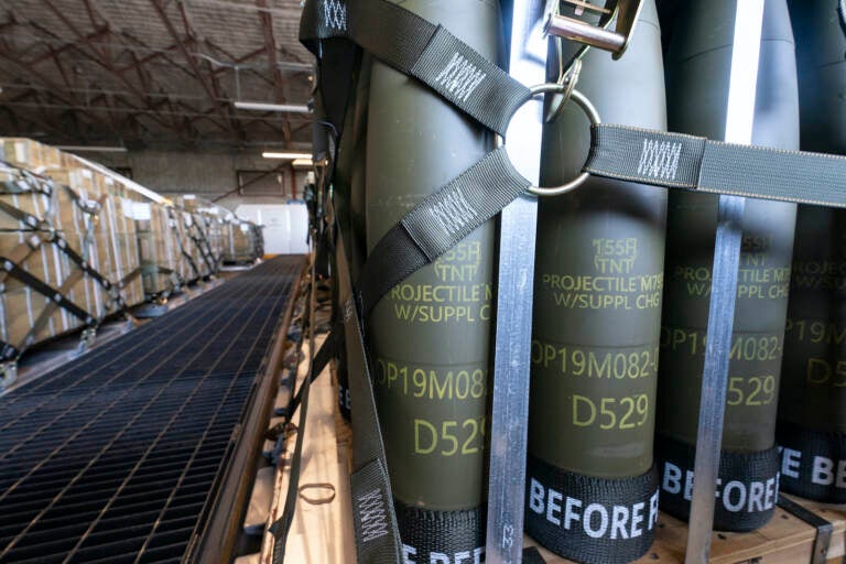 Pallets of 155 mm shells are loaded by the 436th Aerial Port Squadron at Dover Air Force Base