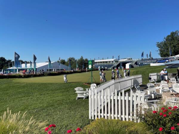 The pros practiced on the putting green before teeing off. (Cris Barrish/WHYY)