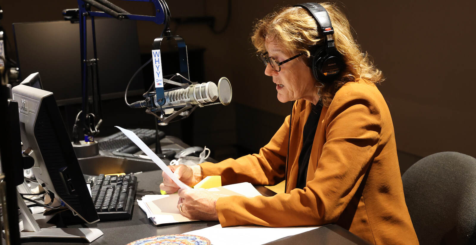 Marty Moss-Coane sits behind the mic at the Radio Times studio