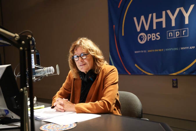 Marty Moss-Coane sits behind the mic at the Radio Times studio