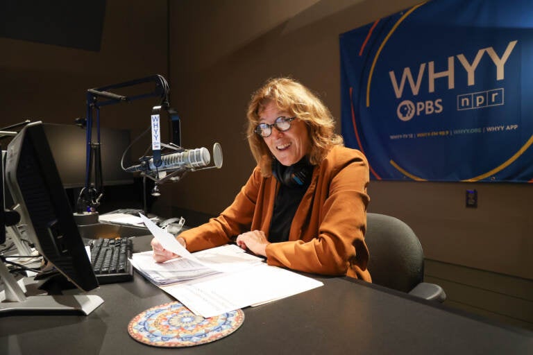 Marty Moss-Coane sits behind the mic at the Radio Times studio