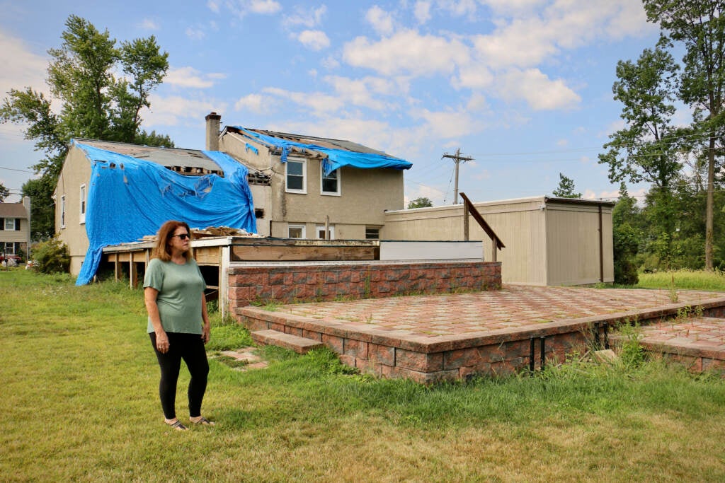 Tammy Echevaria stands in her backyard