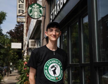 Conor Alguire, a Starbucks barista trainer and union organizer, fighting for worker rights, outside the coffee shop at 22nd and South Street on Labor Day, September 5, 2022. (Kimberly Paynter/WHYY)