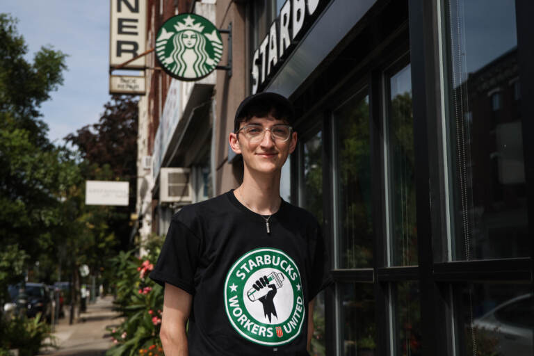 Conor Alguire, a Starbucks barista trainer and union organizer, fighting for worker rights, outside the coffee shop at 22nd and South Street on Labor Day, September 5, 2022. (Kimberly Paynter/WHYY)