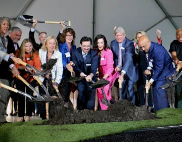 Philadelphia Ballet artistic director Angel Corella (center) and executive director Shelly Power (in pink), joined by donors and poltical figures, participate in a ceremonial groundbreaking for the company's new building on North Broad Street. (Emma Lee/WHYY)