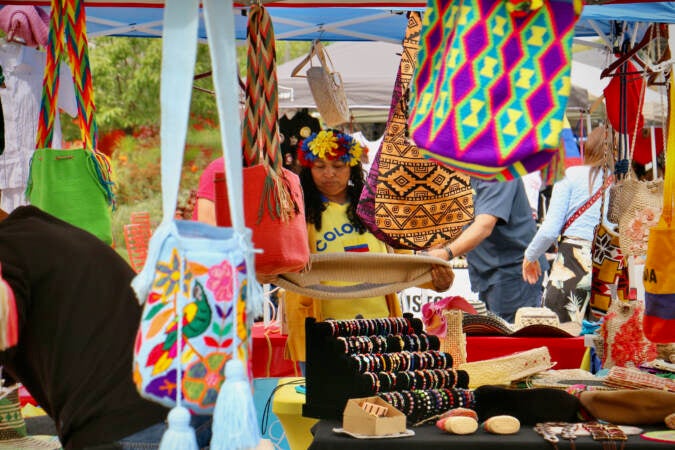 Local entrepreneurs representing fourteen  countries set up shop at the Latin America Thrives in Philadelphia event at Love Park. (Emma Lee/WHYY)