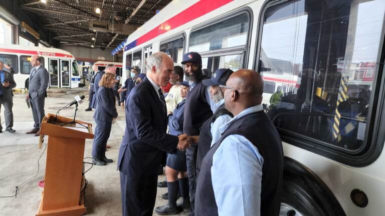 U.S. Sen. Bob Casey of Pennsylvania workers at the SEPTA Allegheny bus depot. (Tom MacDonald/WHYY)