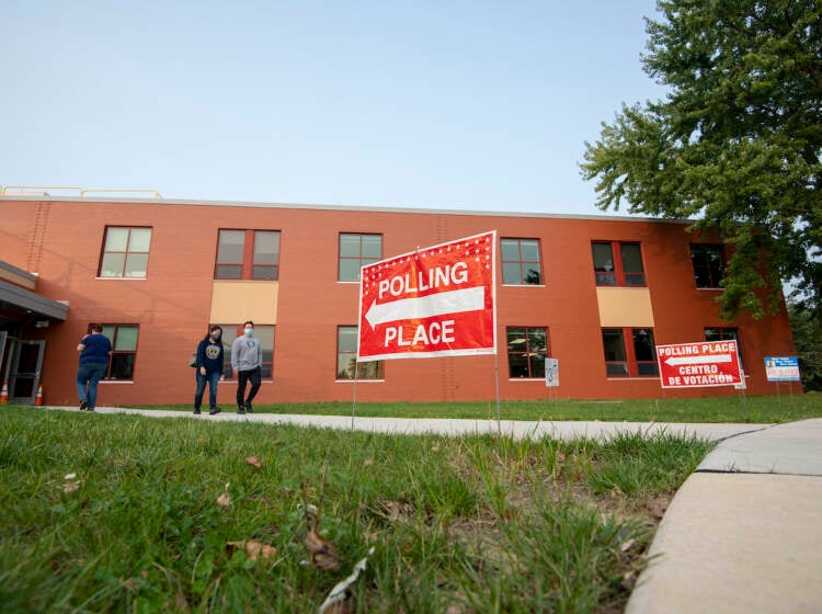 Voters outside of a building