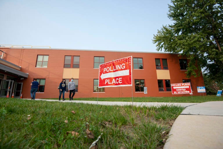 Voters outside of a building