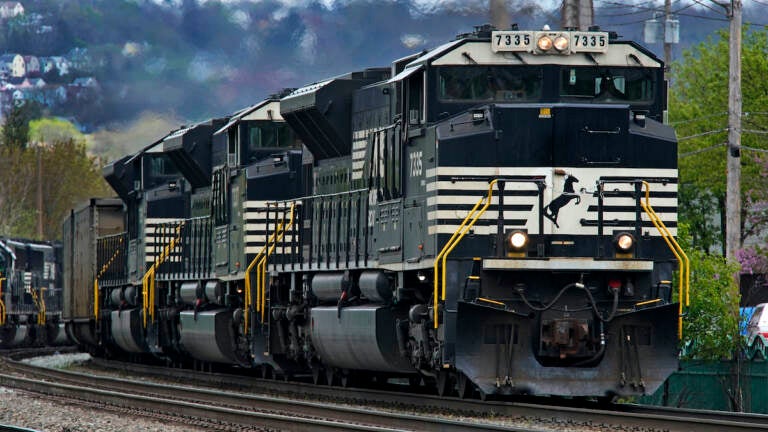 File photo A Norfolk Southern freight train makes its way through Homestead, Pa., on April 27, 2022.  (AP Photo/Gene J. Puskar, File)