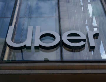 File photo: An Uber sign is displayed at the company's headquarters in San Francisco, Monday, Sept. 12, 2022. (AP Photo/Jeff Chiu, File)