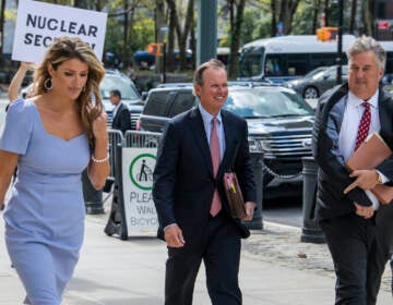 Former President Donald Trump's attorneys Linsey Halligan, James Trusty, and Chris Kise arrive at Brooklyn Federal Court on Tuesday, Sept. 20, 2022, in New York.  (AP Photo/Brittainy Newman)
