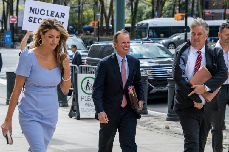 Former President Donald Trump's attorneys Linsey Halligan, James Trusty, and Chris Kise arrive at Brooklyn Federal Court on Tuesday, Sept. 20, 2022, in New York.  (AP Photo/Brittainy Newman)