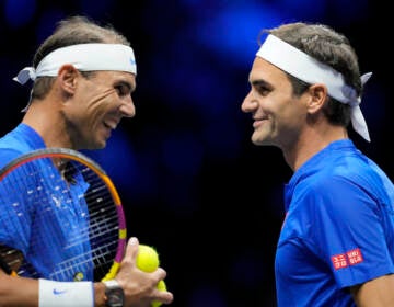 Team Europe's Roger Federer, right, and Rafael Nadal react during their Laver Cup doubles match against Team World's Jack Sock and Frances Tiafoe at the O2 arena in London, Friday, Sept. 23, 2022. (AP Photo/Kin Cheung)