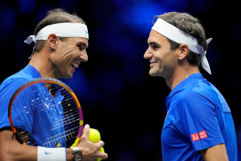 Team Europe's Roger Federer, right, and Rafael Nadal react during their Laver Cup doubles match against Team World's Jack Sock and Frances Tiafoe at the O2 arena in London, Friday, Sept. 23, 2022. (AP Photo/Kin Cheung)