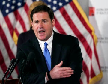 File photo: In this Dec. 2, 2020, file photo, Arizona Republican Gov. Doug Ducey answers a question during a news conference in Phoenix.  (AP Photo/Ross D. Franklin, Pool, File)