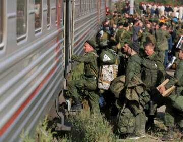 Russian recruits take a train at a railway station in Prudboi, Volgograd region of Russia, Thursday, Sept. 29, 2022. Russian President Vladimir Putin has ordered a partial mobilization of reservists to beef up his forces in Ukraine. (AP Photo)