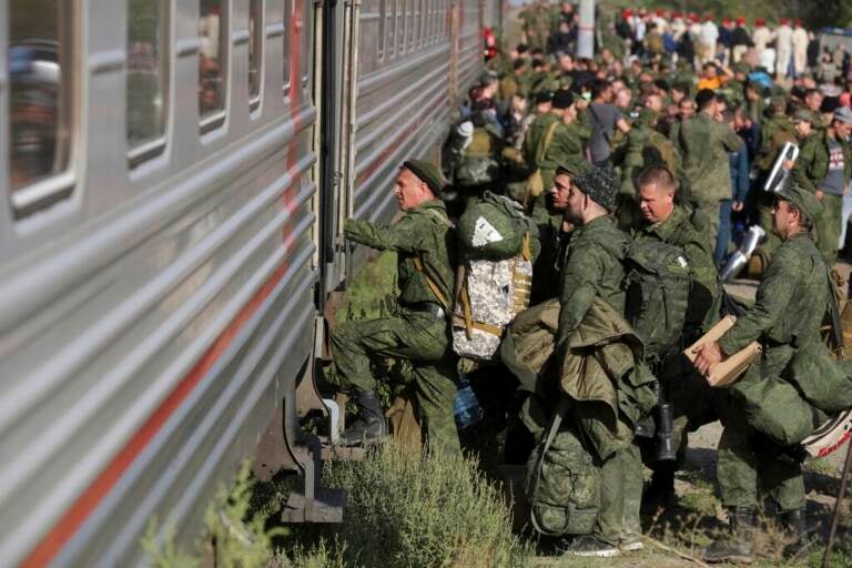 Russian recruits take a train at a railway station in Prudboi, Volgograd region of Russia, Thursday, Sept. 29, 2022. Russian President Vladimir Putin has ordered a partial mobilization of reservists to beef up his forces in Ukraine. (AP Photo)