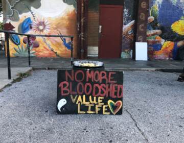 On Saturday, Sept. 10, at Mill Creek Recreation Center, neighbors and loved ones paid tribute to Tiffany Fletcher, a mother of three who was killed by a stray bullet Friday afternoon in front of the center. (Emily Rizzo/WHYY)