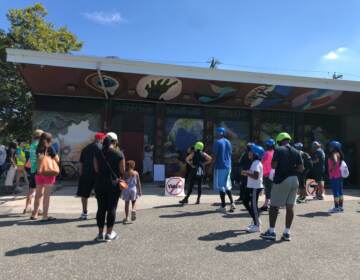 West Philadelphia community members gathered outside the Mill Creek Rec Center for a ceremony to honor Tiffany Fletcher and voice opposition to gun violence. (Emily Rizzo/WHYY)